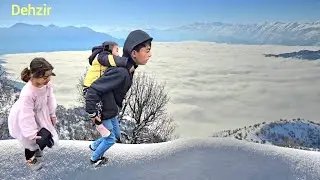 Children's happiness on a trip to the city; buying clothes and playing in the snow with Mr. Qurban