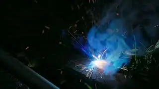 stick welding on grass closeup