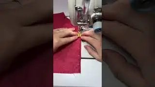 sewing dark red patterned fabric using industrial sewing machine manually