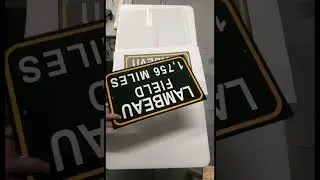 Custom mileage 12&rdquo;x18&rdquo; Lambeau Field sign made from a heavy gauge aluminum.