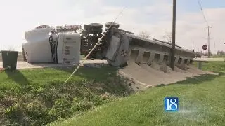 Semi rollover causes grain spill
