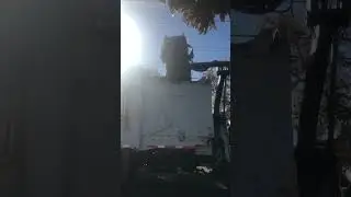 Recology side loader picks up trash can.