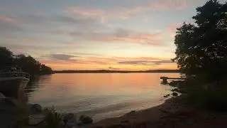 Green Screen Background a sunset over the water at a jetty at a little beach/Chroma Key Backgrounds