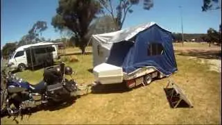 Camper trailer fully deployed on site