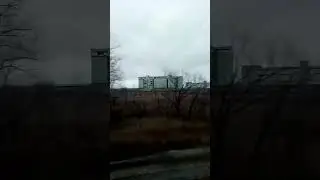 Элеватор зерновой из окна вагона железнодорожного поезда Grain elevator from window train carriage