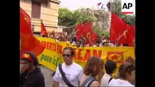 Thousands march through Genoa at start of G8 summit.