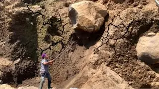the miners' reckless action of rolling a giant rock