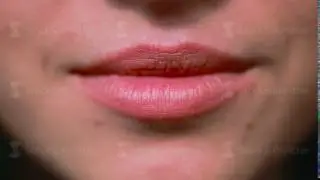 Close-up of a young girl's lips, beautiful natural smile