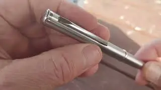 silver tactical pen knife and pen
