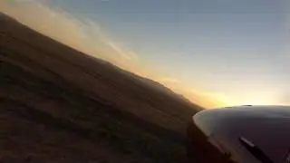 Landing Cessna 180 Skywagon off-field, front view.