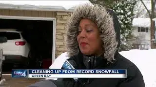 Green Bay neighbors clean up after record breaking snowfall