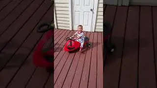 Baby Carson on the scooter
