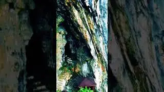 Scattered wooden houses and the Mysterious cave behind
