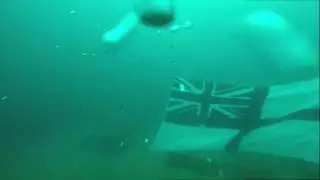 HMS ROYAL OAK Northern Diving Group, raising ensign & placing memorials.