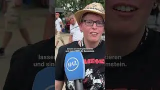 Rammstein-Fans und Demonstrierende stehen sich am Olympiastadion gegen&uuml;ber