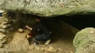 The girl cooked and slept in a rock crevice in the forest