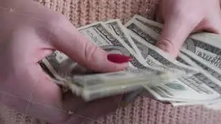 Woman hands counting US Dollar bills