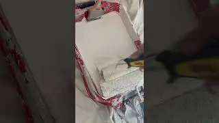 Getting your mini roller loaded with paint!