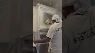 Spraying Paint over Kitchen Cabinets