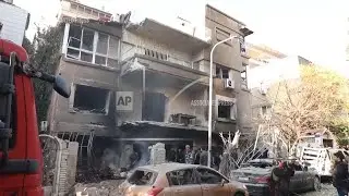 Emergency services at scene after 2 Israeli airstrikes hit Syria's capital and a suburb