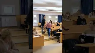 Teacher help mother in classroom