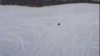 Girl launches herself on snowmobile