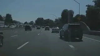 Tesla Model 3 negotiates difficult off ramp merge