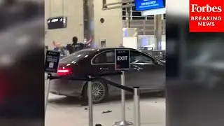 RAW VIDEO: Police Seen Detaining Man After Vehicle Drives Into Detroit Airport Check-In Counter