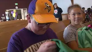 Minnesota Vikings Coach Mike Zimmer gives away backpacks