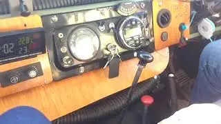 1968 Land Rover 6 cylinder pulling onto the freeway