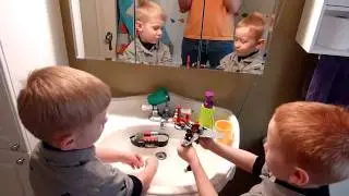Calvin And Holden Play With Lego In The Sink
