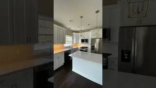 Kitchen Reno-Quartz Countertops, White Shaker Cabinets, Marble Herringbone Backsplash, & Wood Floors