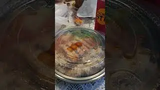 Eating a salmon bowl with veggies from Pick Up Stix