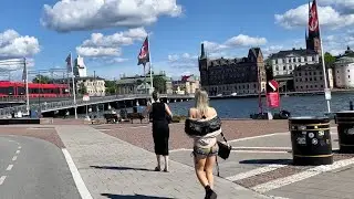 Stockholm bikes: central street life in summer. From Kungsholmen to Old Town. 4K, street sounds