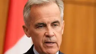 Prime Minister Mark Carney announces EV mandates review, tariff supports