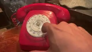 Moving 2 three times on an old red rotary phone