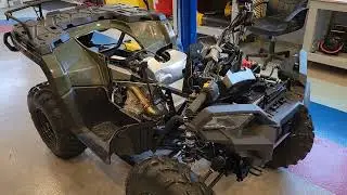 Adding power steering a winch and body armor to my 450 Polaris Sportsman 4 wheeler.