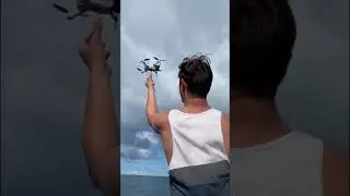 Person Jumps Into Sea to Save Drone After it Hits Boat's Edge and Falls Off - 1411076