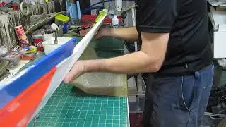 Covering a foam wing with brown packaging paper