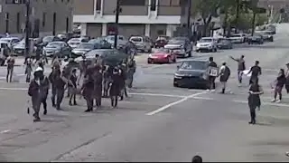 Car drives into crowd of protesters