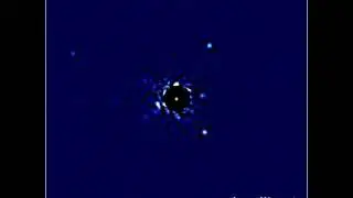 Star HR 8799 showing four planets in orbit rotation