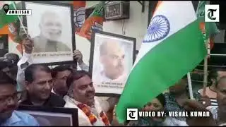 BJP workers celebrate after Modi government's move to scrap of Article 370