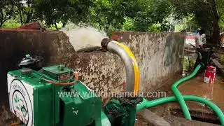 Water being pumped out of flooded road at Adchini in South Delhi: heavy rains do Delhi roads in