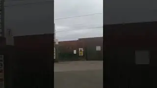 Class 66785 Passing Claydon Level Crossing