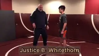 Headlock hip toss defense