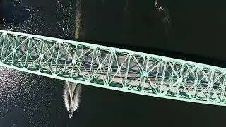 4K Aerial Drone Footage Looking Straight Down on Boats on A River While Going Under A Bridge Royalty