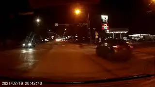 Cars run through dead traffic light at night