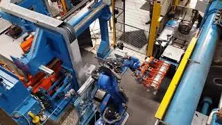 New press feeding with 6 axis robot for a back loading SMS press