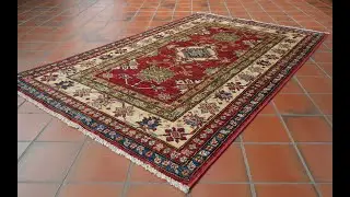 Handmade Afghan Kazak rug in vegetable dyed wool and classic design 309581