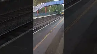 A chiltern railways class 168 train passing king sutton at speed